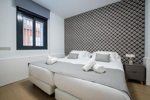 Кровать или кровати в номере Ibericabeds Granada