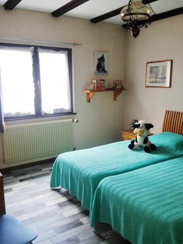 Una cama o camas en una habitación de Chambres d'hôtes et Gîte chez Martine