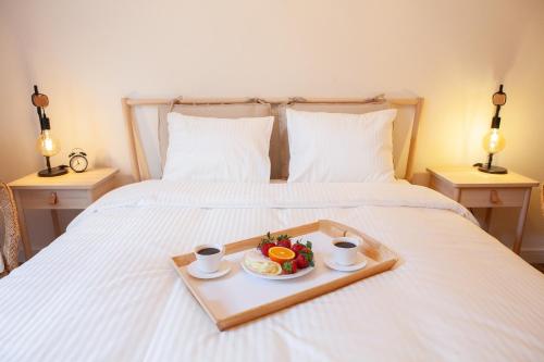 Łóżko lub łóżka w pokoju w obiekcie Apartamenty Pocztowa