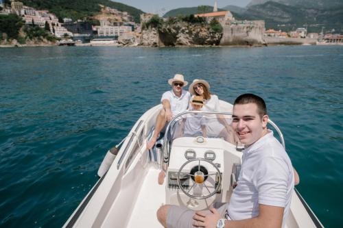 a group of people on a boat in the water at La Villa Boutique Hotel in Budva