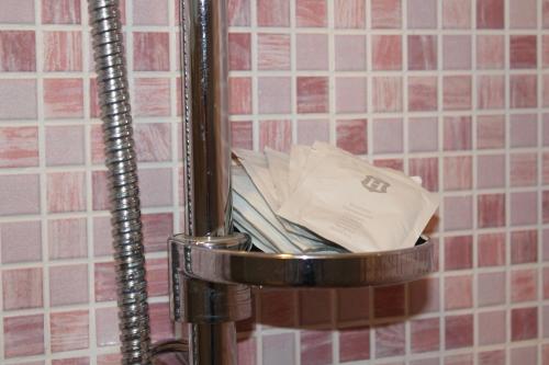 a trash can with a pile of paper in it at Casa Alessia in Villasimius