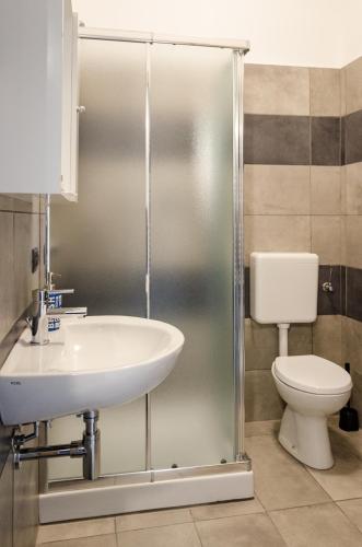 a bathroom with a sink and a toilet at La Montrucca Camere in Caselle Torinese