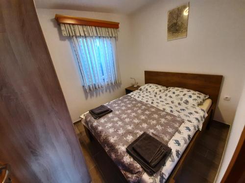 Ένα ή περισσότερα κρεβάτια σε δωμάτιο στο Sunrise Apartments