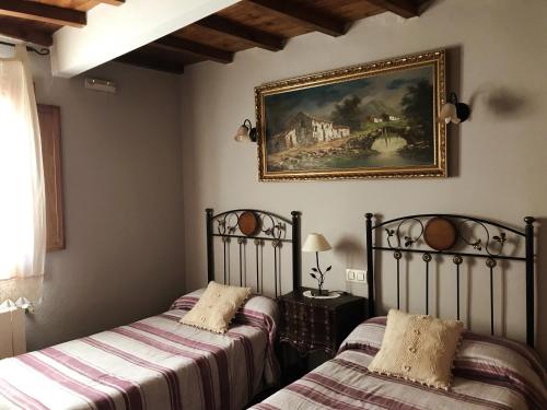 Llit o llits en una habitació de Casa Barrero