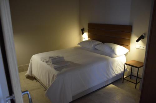 Postel nebo postele na pokoji v ubytování Chacón Apartments & Suites
