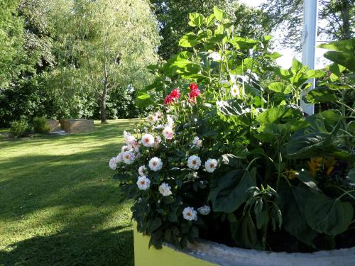 a bouquet of flowers in a box in a yard at Skogis Bed & Breakfast in Katrineholm