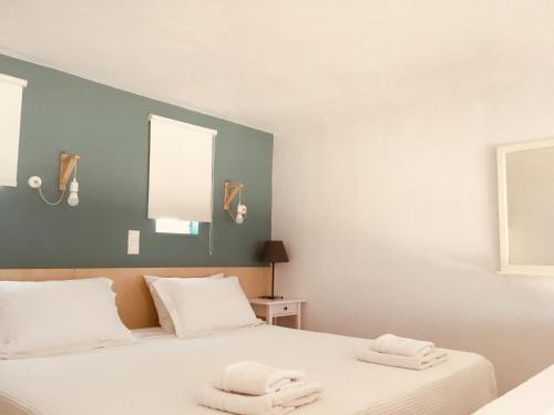 A bed or beds in a room at Theodosia Studios