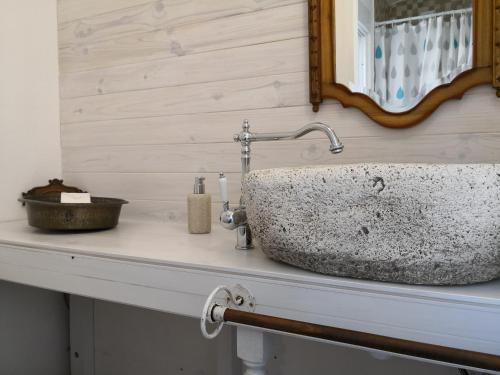 a bathroom counter with a sink and a mirror at Be My Neighbour in Lisbon