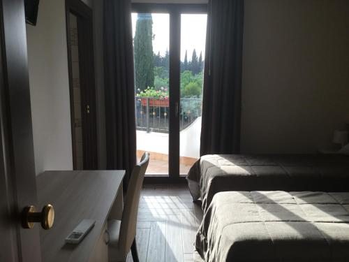 Una cama o camas en una habitación de Villa Niscima