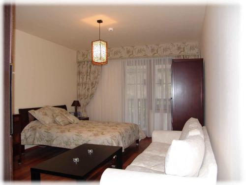 Ένα ή περισσότερα κρεβάτια σε δωμάτιο στο Apartament Pod Aniołem - Gdański