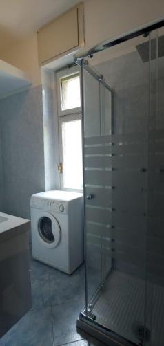 a washing machine in a bathroom with a window at Bellagio Dream in Valbrona