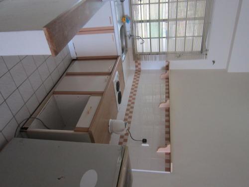 an overhead view of a kitchen with a sink and cabinets at Paradise Lagoon Apartment in Port Dickson
