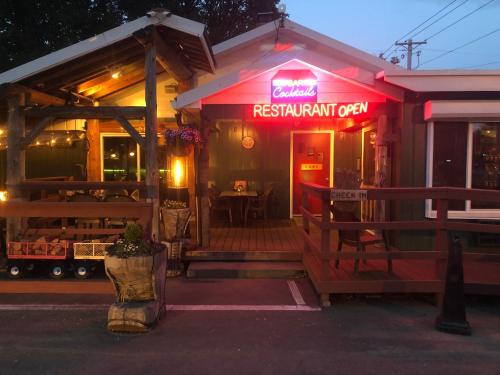 a restaurant with a sign that reads restaurant open at Lone Fir Resort in Cougar
