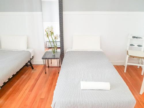 Posteľ alebo postele v izbe v ubytovaní Pension Aussie Guesthouse