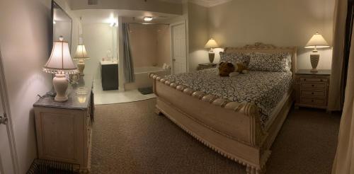 a bedroom with a dog sitting on a bed at Luxury condo in the heart of Pigeon Forge in Pigeon Forge