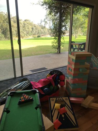 a room with a table with a stack of bricks at Cadell On The Murray Motel in Moama