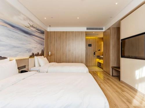 Ένα ή περισσότερα κρεβάτια σε δωμάτιο στο Atour Hotel Hefie Binghu Yingtai City Branch