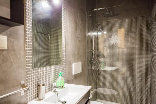 a bathroom with a sink and a shower at Rossio Convento da Encarnação in Lisbon