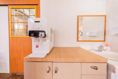 a kitchen with a microscope on top of a counter at Tokyo SA Ryokan in Tokyo