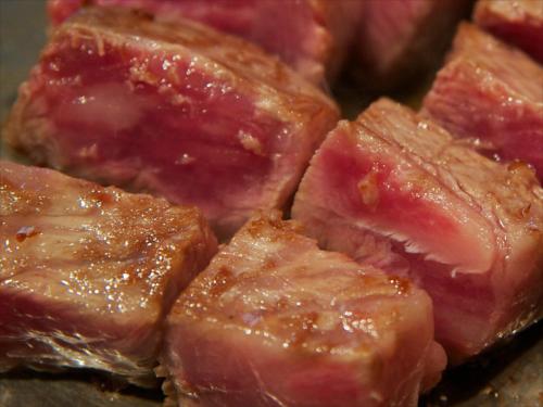 a close up of a pile of cooked meat at Arima Onsen Tocen Goshobo in Kobe