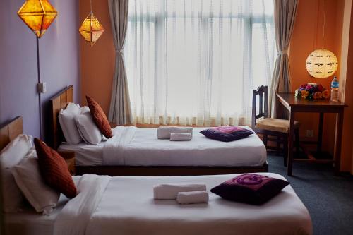 Katil atau katil-katil dalam bilik di Bodhi Guest House