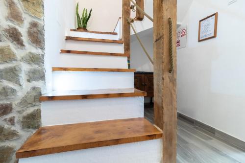 a stairwell in a house with wooden steps at Mirta in Stara Baška