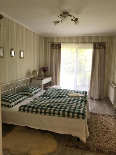 Postel nebo postele na pokoji v ubytování Holiday home Usadba Novoselitsa