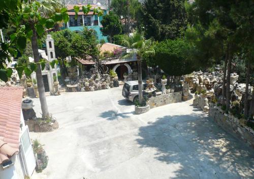 a group of gravestones in a driveway of a house at Greenfields Country Club in Limassol