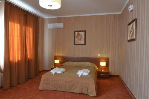 Katil atau katil-katil dalam bilik di Citadel Hotel