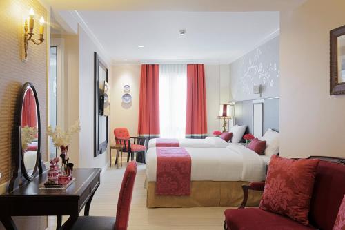 Ένα ή περισσότερα κρεβάτια σε δωμάτιο στο Sara's Hotel