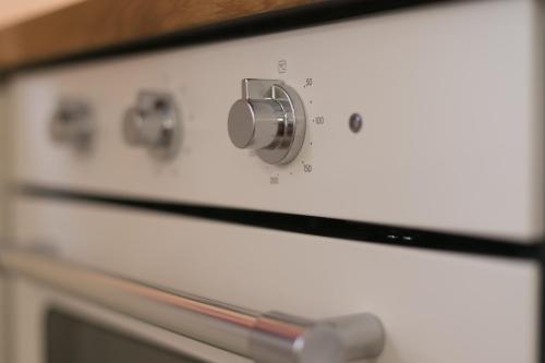 a close up of an oven with a knob at House Smolčić in Otočac