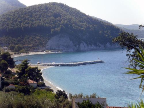 a beach in the middle of a body of water at Nemesis in Neo Klima