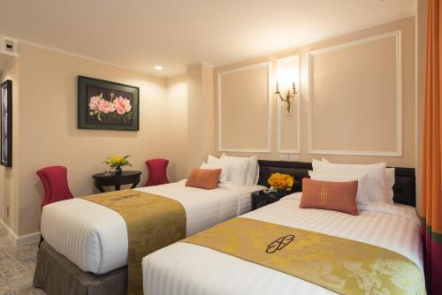 Ένα ή περισσότερα κρεβάτια σε δωμάτιο στο Sara's Hotel