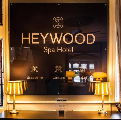 a window of a spa hotel with two lamps at Heywood Spa Hotel in Tenby