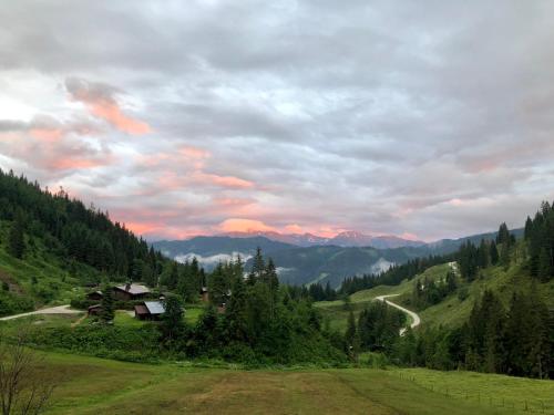 a view of a valley with mountains in the background at Landhaus Rieding in Mühlbach am Hochkönig