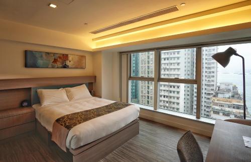 Una cama o camas en una habitación de Mia Casa Hotel
