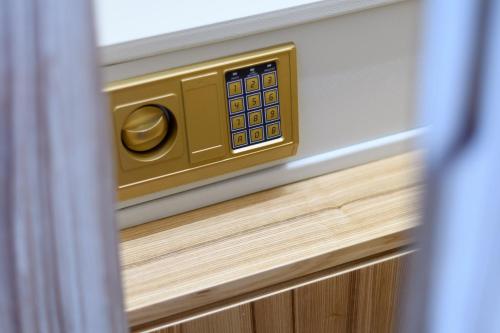 a close up of a drawer with a gold door nob at The Summit of Mykonos in Kalo Livadi