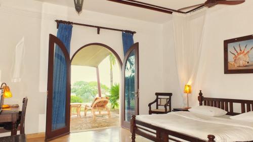 Кровать или кровати в номере Vipingo Ridge-Swahili Villa