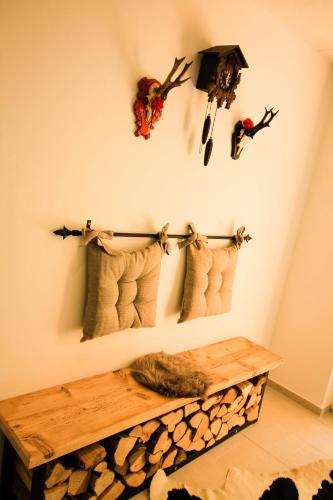 a room with a bench and skulls on the wall at Black Forest Apartements by Hotel Grüner Baum Feldberg in Feldberg