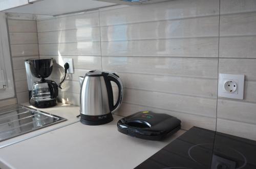 a coffee maker on a counter in a kitchen at Palaiokastro view in Karpathos Town
