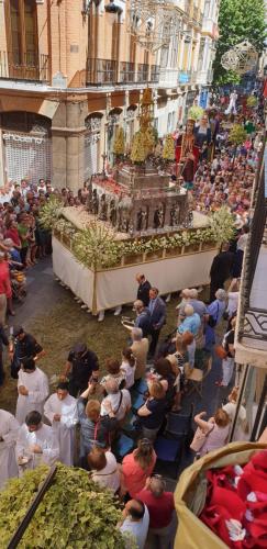 a crowd of people sitting around a table in a crowd at Pension Mesones in Granada