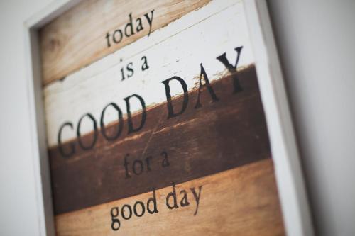a picture of a clock with the words goodfaith for a good day at House Smolčić in Otočac