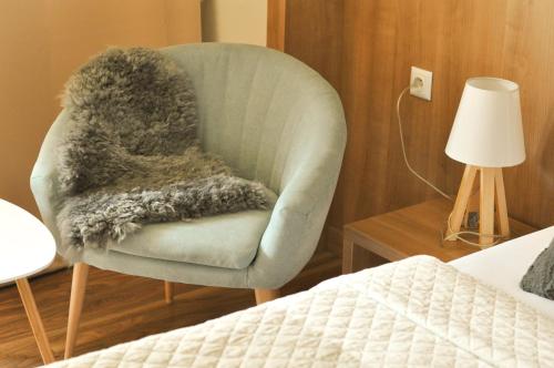 Una cama o camas en una habitación de Hotel Garni