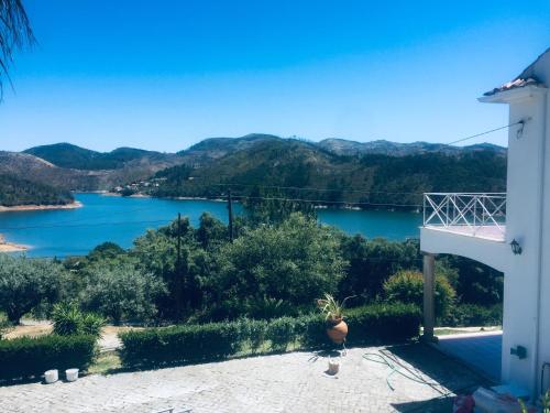 a view of a lake from a house at Lakeside Rest in Ferreira do Zêzere