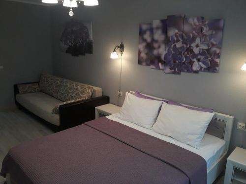 Ένα ή περισσότερα κρεβάτια σε δωμάτιο στο PaulMarie Apartments on Krasnoznamennaya