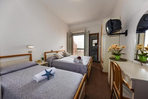 Postel nebo postele na pokoji v ubytování Hotel Caesar