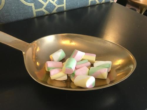 a bunch of marshmallows in a measuring spoon at Opiston Kunkku in Lahti