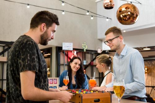 a group of people playing a board game at ibis Budapest Castle Hill in Budapest