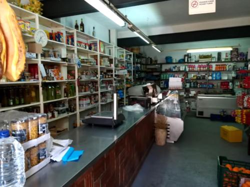 a store aisle with a counter in a store at Casa Rural Barracas in Barracas