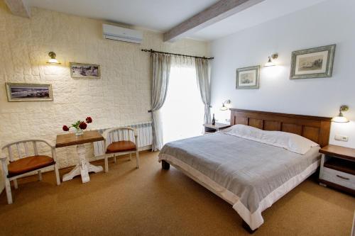 Un pat sau paturi într-o cameră la Zdybanka